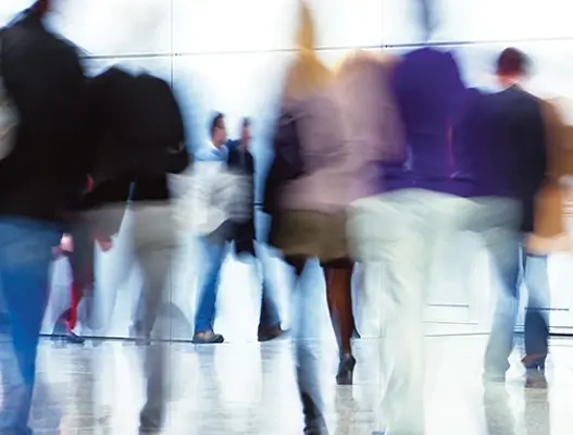 Abstract image of blurred people walking